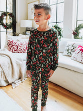 Step into the magic of the season with our Mystic Forest unisex fitted pajamas. Featuring a charming woodland-inspired print with evergreen trees and forest details, this holiday pajama set brings a touch of winter wonder to cozy nights. Made from soft, stretchy fabric for a snug yet comfortable fit, these fitted Christmas pajamas are perfect for lounging, sleeping, or matching family holiday photos.